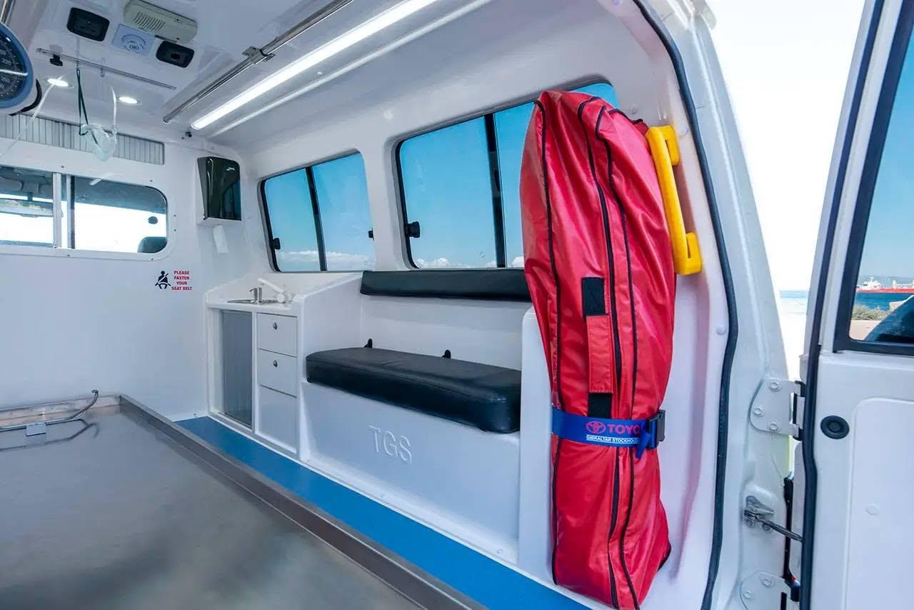 Ambulance interior — patient compartment with attendant bench